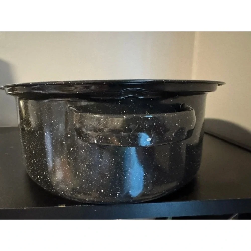 Granite Ware 15-inch oval roaster pan with a lid, speckled black enamel finish.